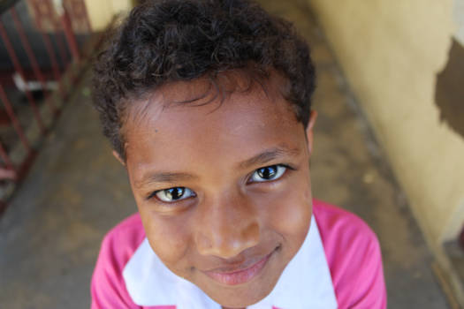Fiji - Cheeky little girl with laughing eyes.